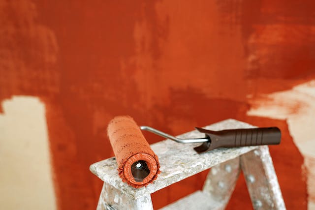 A wall being painted orange.